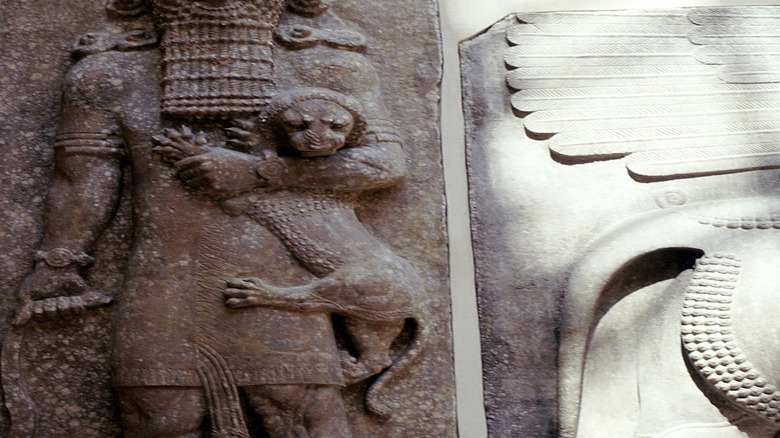A statue of Gilgamesh holding a lion