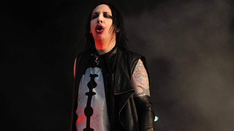 Marilyn Manson standing on stage at the Download Festival in 2009