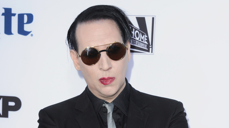Marilyn Manson wearing sunglasses and posing for a photo in 2014