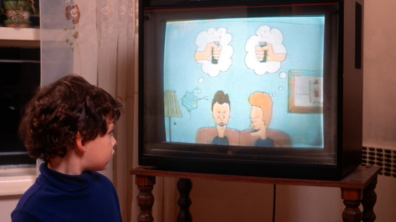 A young child watching the fire episode of Beavis and Butthead