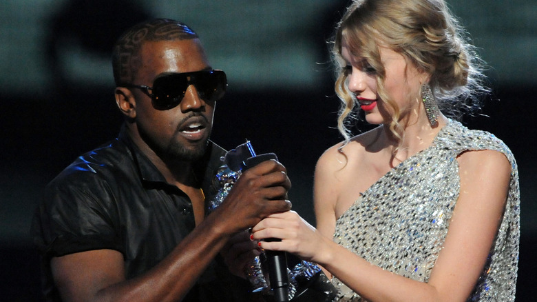 Kanye West grabbing the mic from Taylor Swift at the VMAs