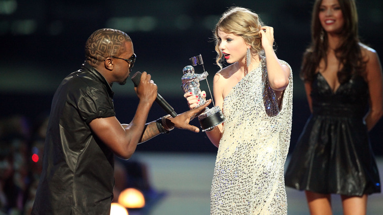 Kanye West interrupting Taylor Swift's acceptance speech at the VMAs