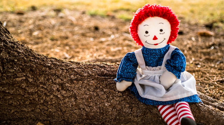 Raggedy Ann doll on tree