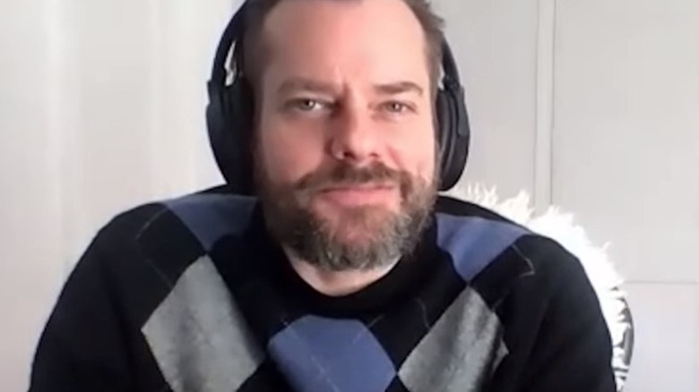 John Zeman wearing headphones