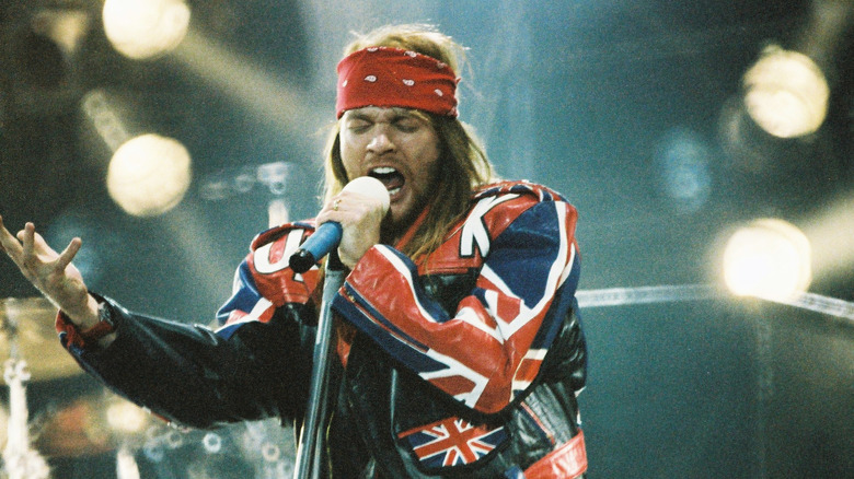 Axl Rose onstage with microphone