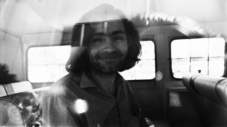 Charles Manson smirking