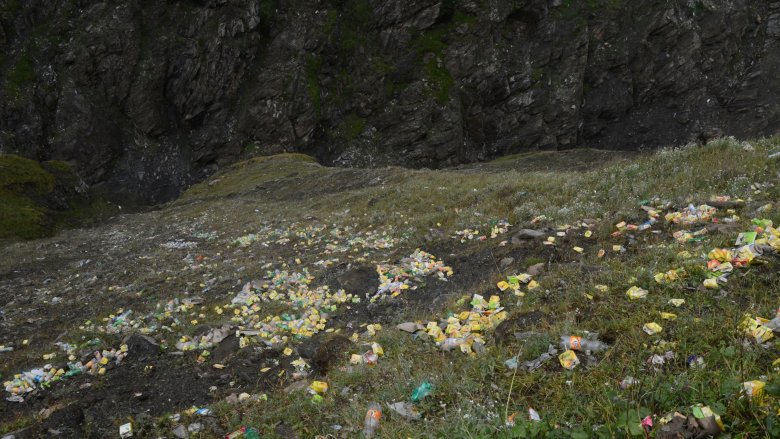 Hillside covered with trash