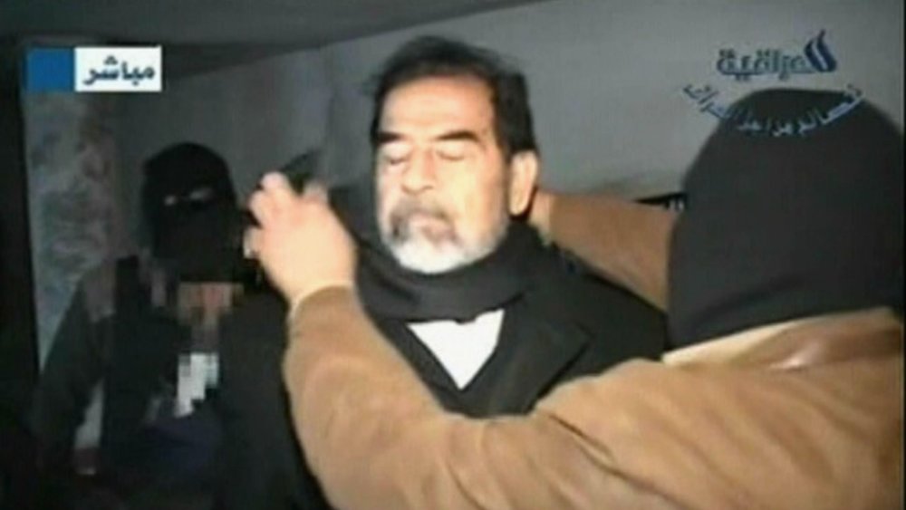 Saddam Hussein refusing a blindfold at his 2006 execution. 