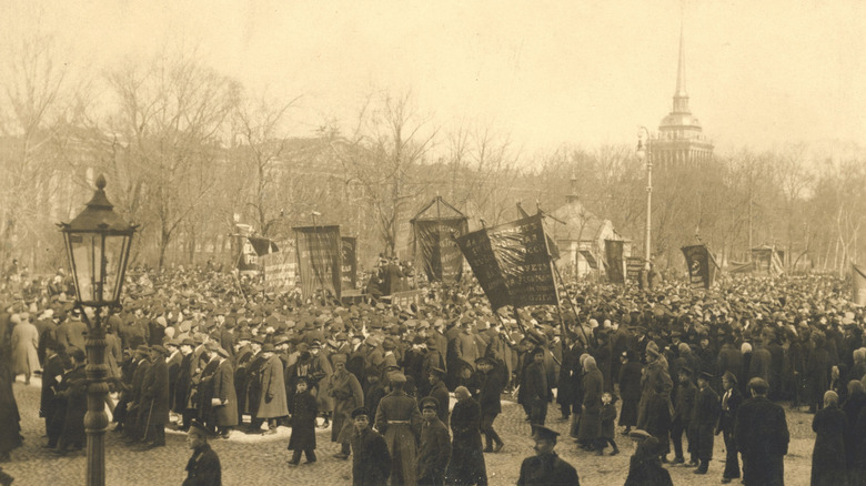 crowd holding signs