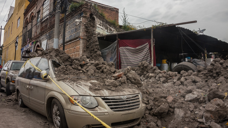 Collapsed building on top of car