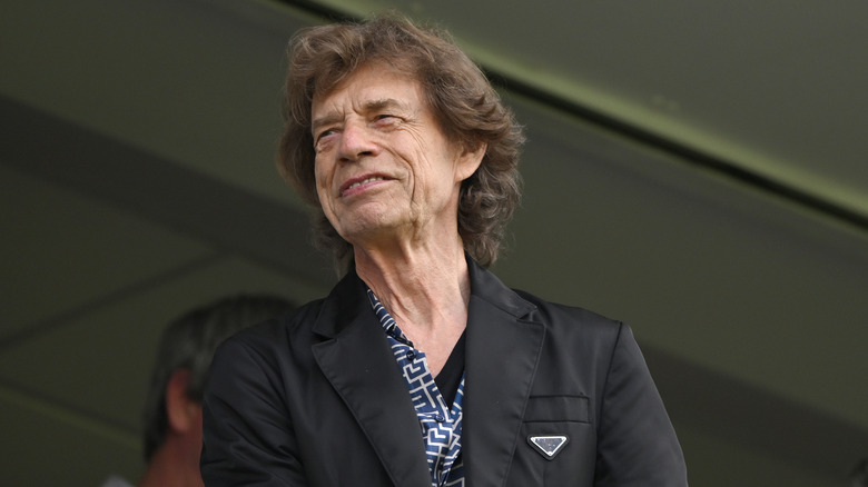 Mick Jagger in 2023, smiling while looking off-camera