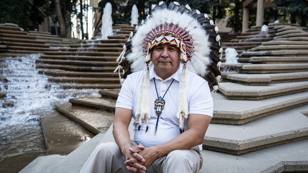 Randy Ermineskin in native headdress 