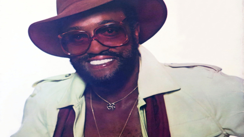 Billy Paul smiling in hat and sunglasses in 1970s