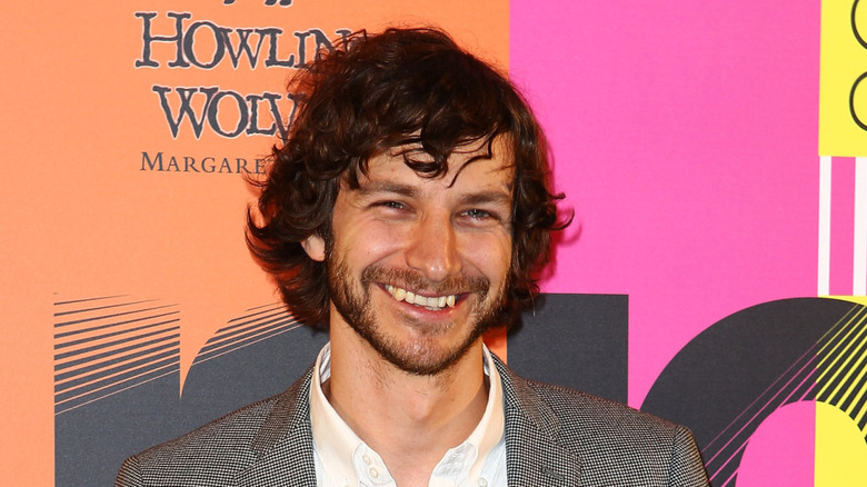 Gotye smiling with beard and messy hair