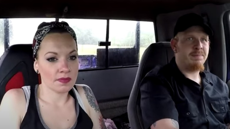 Chico and Sondra driving a truck