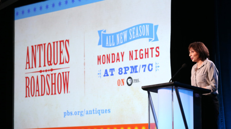 Presentation slide with Antiques Roadshow logo for PBS with a woman talking on a podium