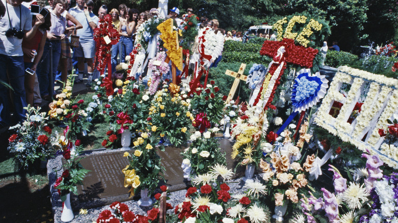 Elvis Presley's gravesite covered in floral tributes