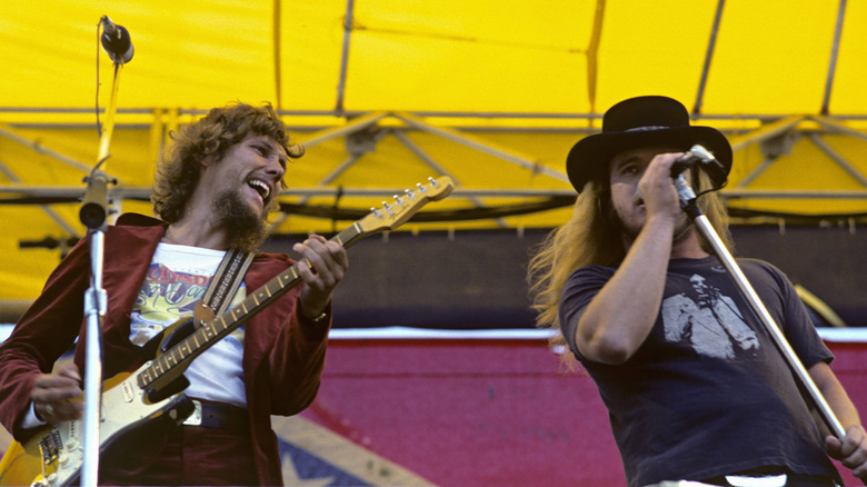 Steve Gaines and Ronnie Van Zant of Lynyrd Skynyrd performing on stage