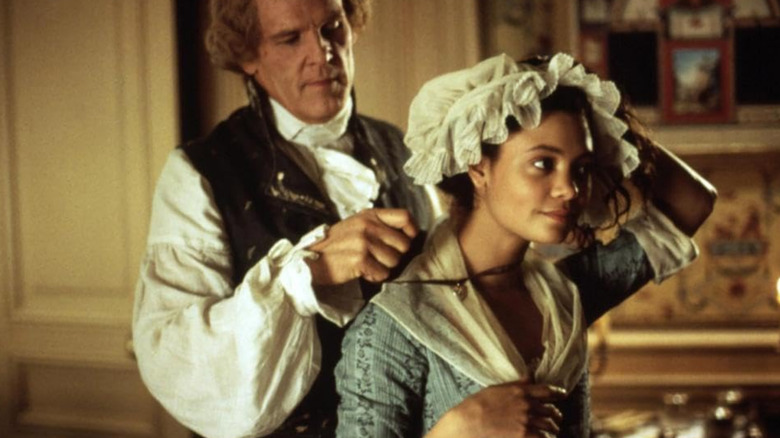 Nick Nolte and Thandiwe Newton standing together in scene from Jefferson in Paris