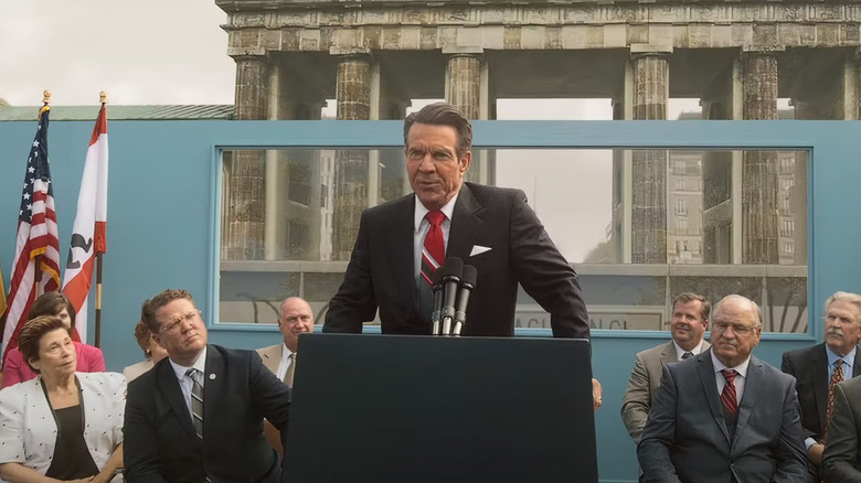 Dennis Quaid as Ronald Reagan giving speech in front of podium