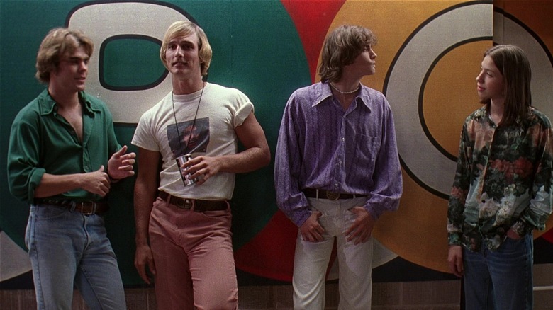 cast of Dazed and Confused standing in front of colorful wall