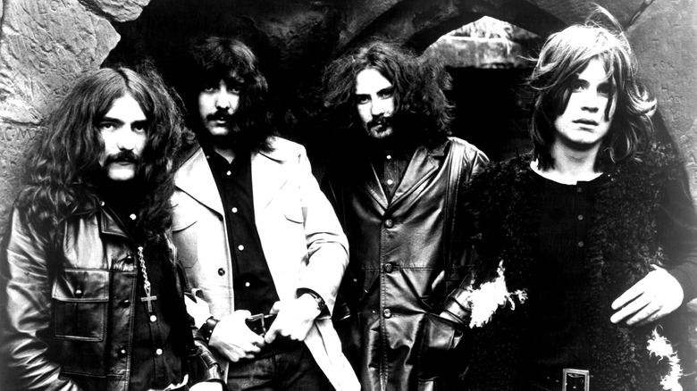 Black Sabbath band members posing for a photo