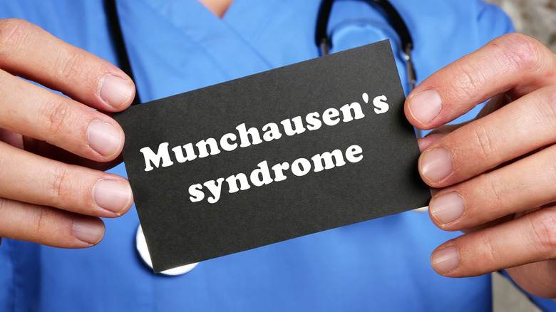 doctor holding munchausen's syndrome card