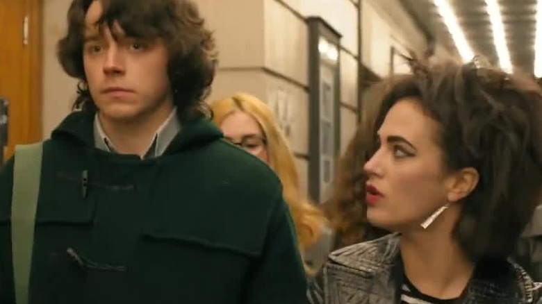 Young Steven Patrick Morrissey walking through school with woman in a still from England Is Mine