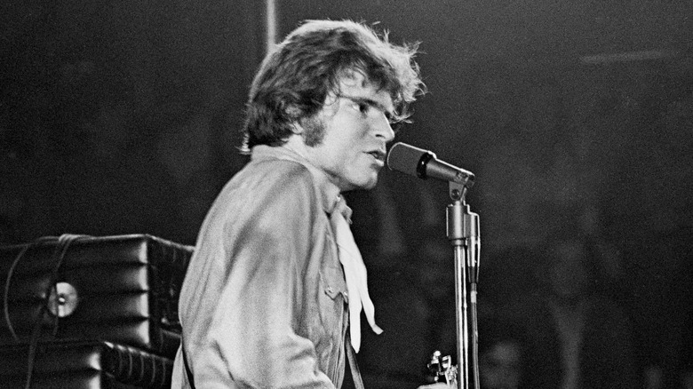 John Fogerty performing on stage