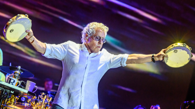 Roger Daltrey with two tambourines