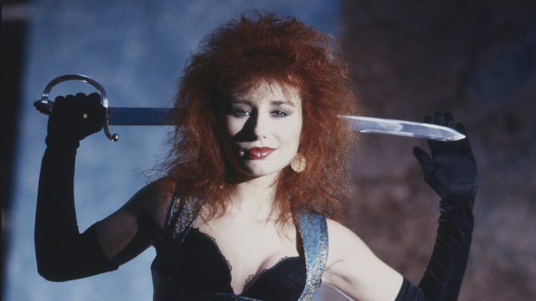Tori Amos poses for album cover with sword behind neck