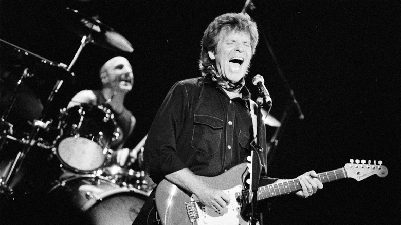 john fogerty performing on stage