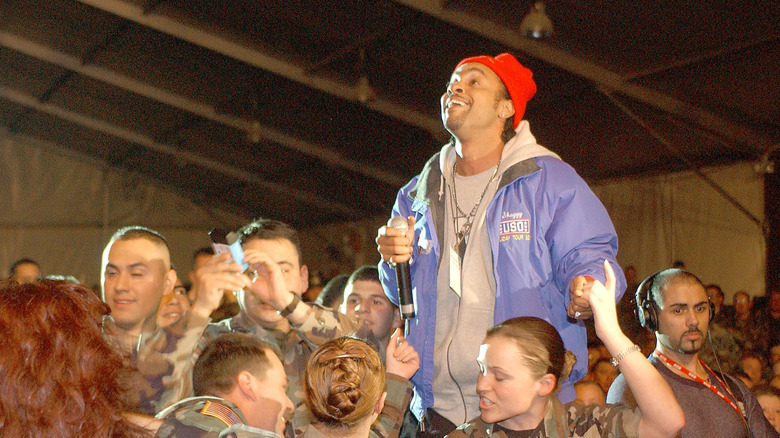 Shaggy in a tent performing a USO show for U.S. troops