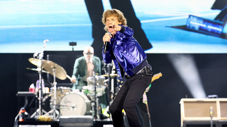 Mick Jagger onstage pointing and singing