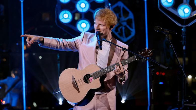 Ed Sheeran performing with guitar