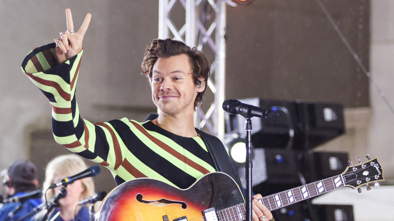 Harry Styles onstage with guitar