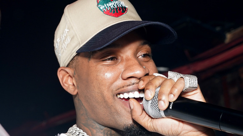 tory lanez laughing with microphone