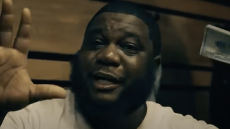 Ar-Ab hands up and holding money in "Rivals" video