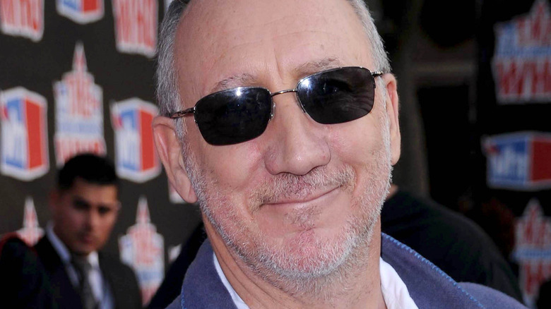 Pete Townshend smirking in sunglasses