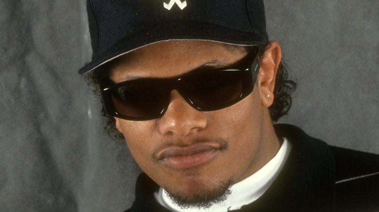 Eazy-E in cap and sunglasses