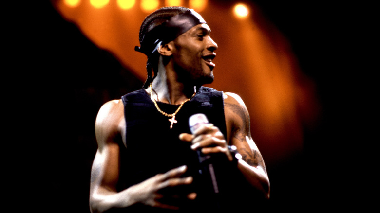 D'Angelo on stage with microphone