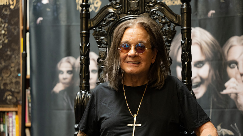 Ozzy Osbourne smiling and wearing cross