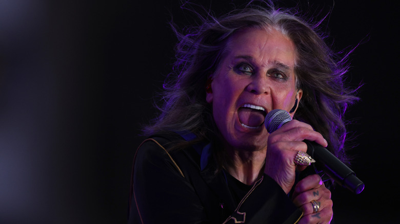 Ozzy Osbourne singing into microphone