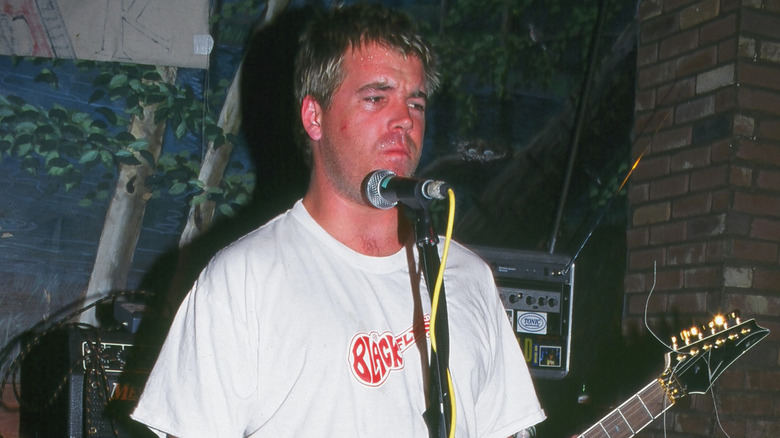 Bradley Nowell on stage playing guitar