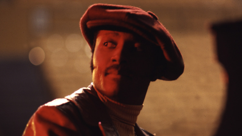 Donny Hathaway sits at piano and looks away