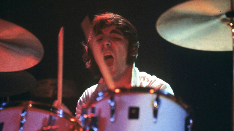 Keith Moon playing drums with mouth open and eyes closed