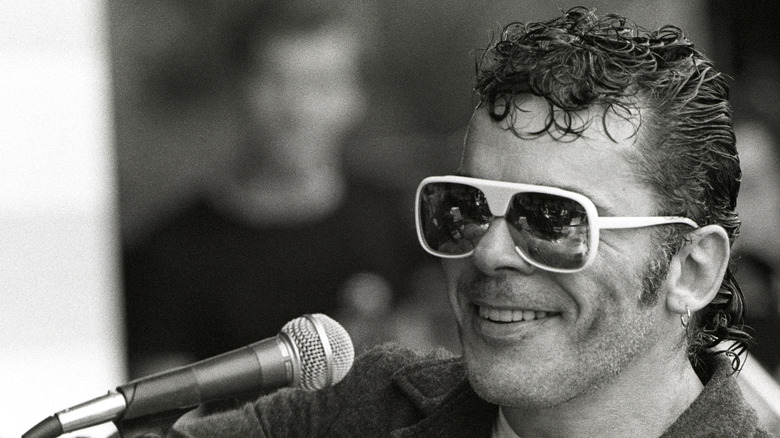 Ian Dury in front of a microphone