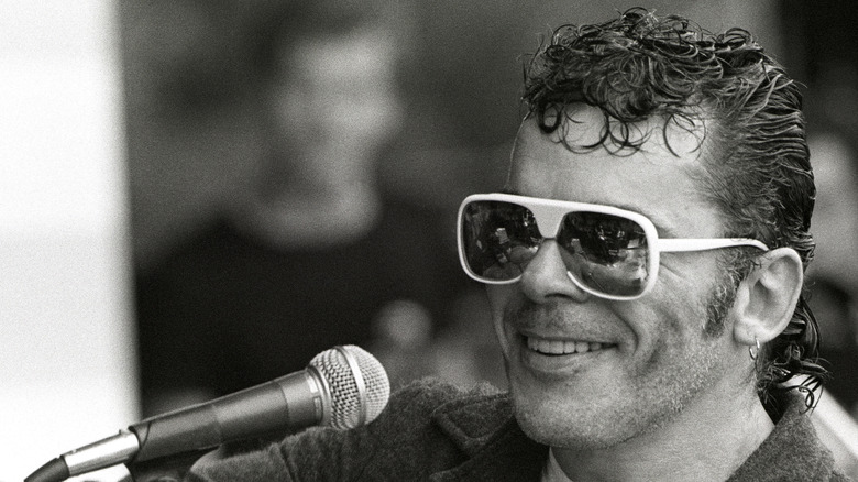 Ian Dury in front of a microphone