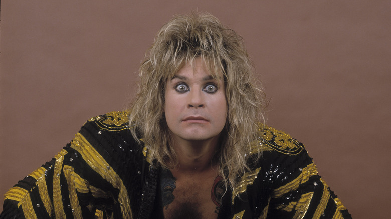 Ozzy Osbourne staring into the camera with a kimono on.