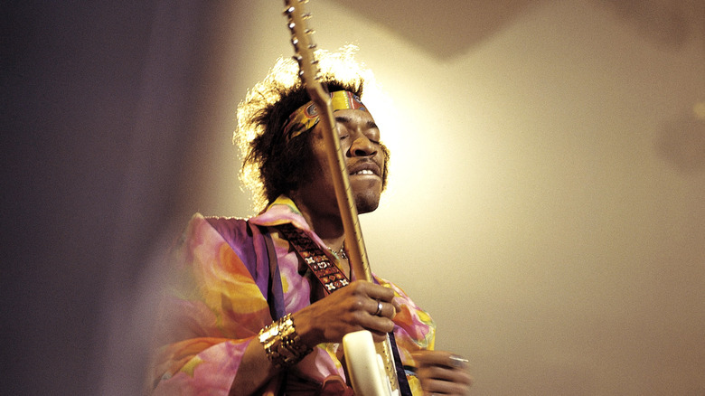 Jimi Hendrix plays guitar with eyes closed in 1969